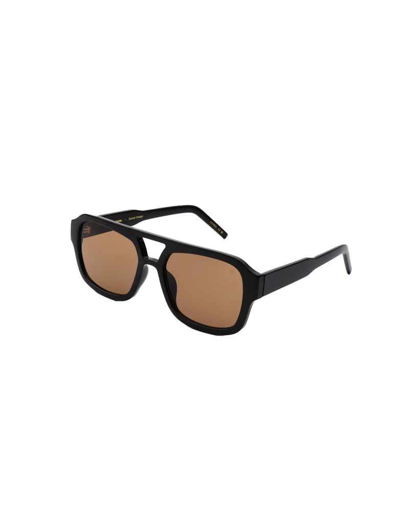 KAYA SUNGLASS BLACK | 70's inspired aviator sunglass with black frames and transparent brown lenses.