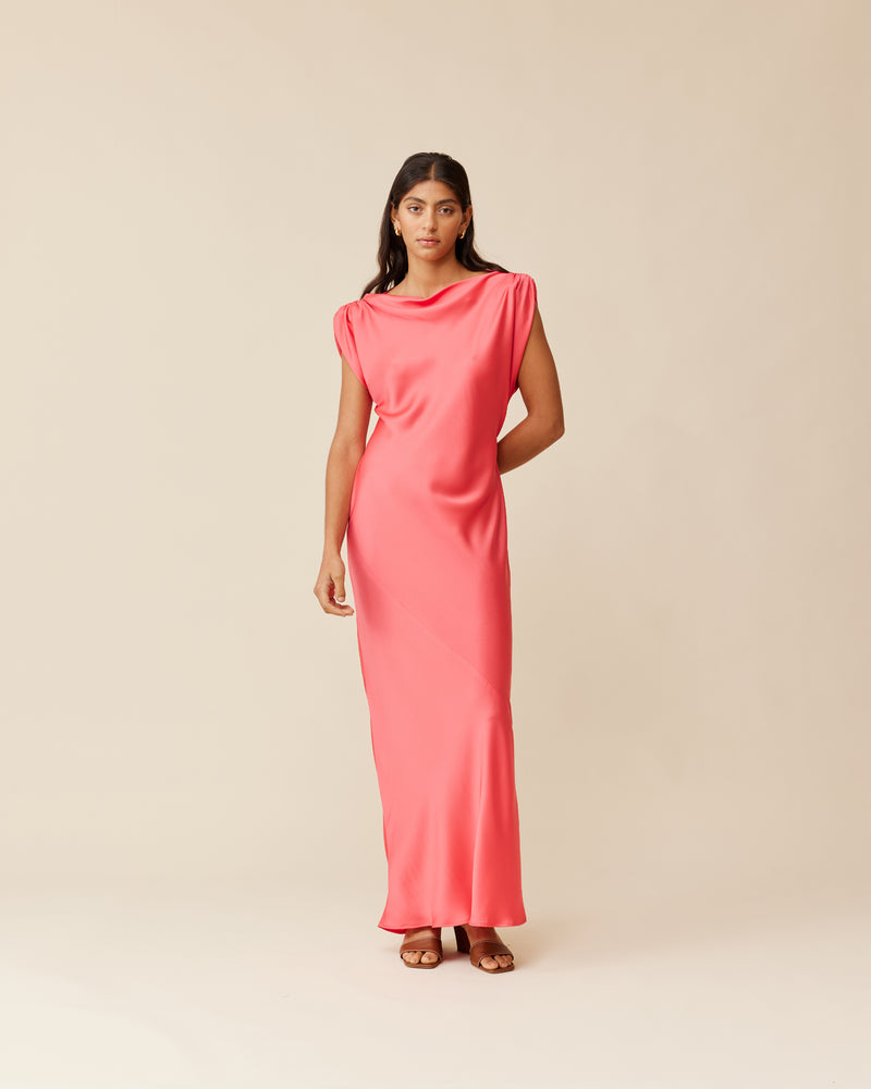 TILT DRESS ROSIE | Bias cut cap sleeve maxi dress crafted in a luxe rosie coloured satin. This piece has an asymmetric ruched shoulder, with one side sitting lower than the other, giving it...
