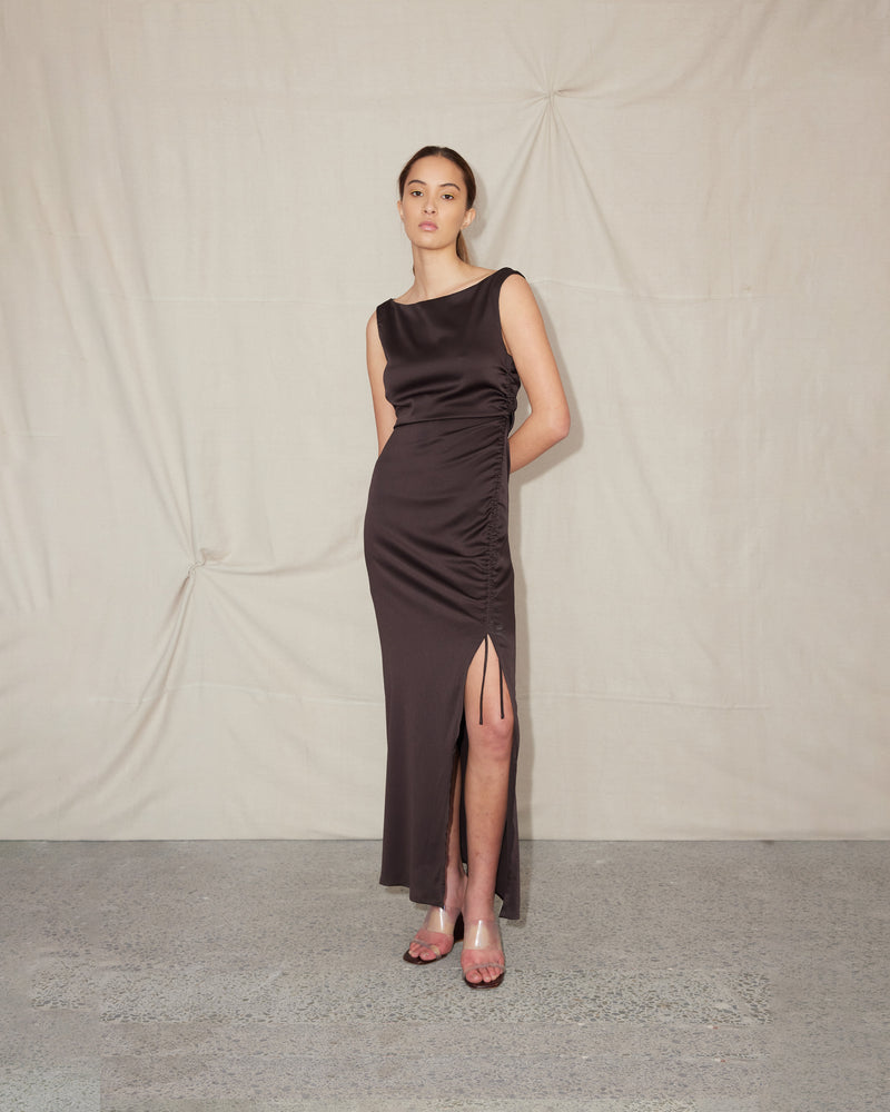 ERCOLINI MAXI DRESS JAVA | Maxi dress with a wide straight neckline and side split cut in a luxe textured java fabric. Features a drawstring at the side seam that creates ruching across the body.