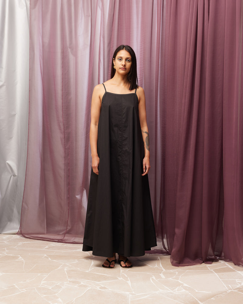 JULIA DRESS BLACK | Maxi slip dress designed in a crisp black organic cotton. This dress has a square neckline and spaghetti straps with contrast stitch detailing and falls to a floaty A-line shape...