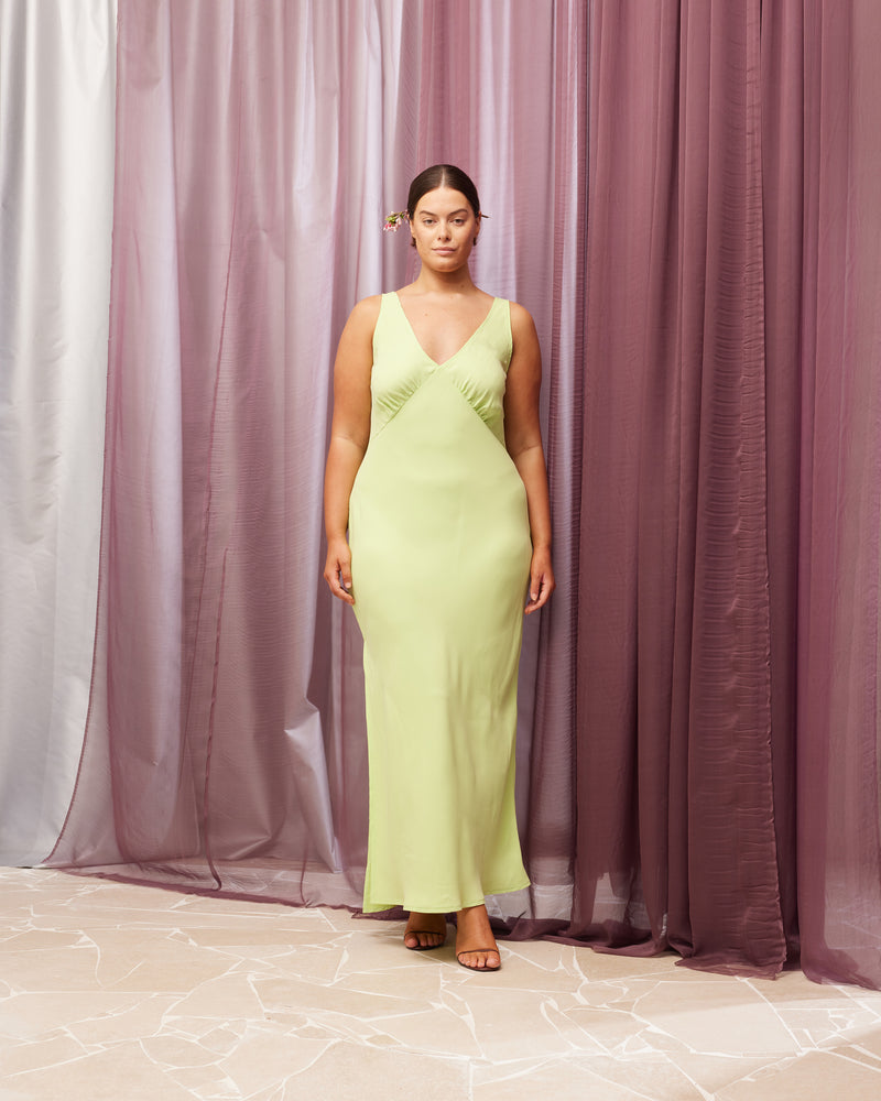 ESMERELDA SLIP DRESS FRESH | Bias cut slip dress in a fresh green magnolia cupro. Wide straps and gathered bust shaping give this dress a vintage look. Features a waist tie and side split for...