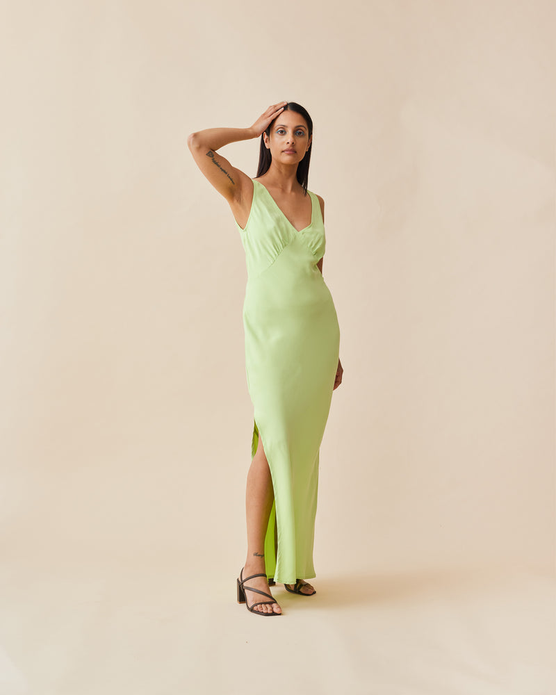 ESMERELDA SLIP DRESS FRESH | Bias cut slip dress in a fresh green magnolia cupro. Wide straps and gathered bust shaping give this dress a vintage look. Features a waist tie and side split for...