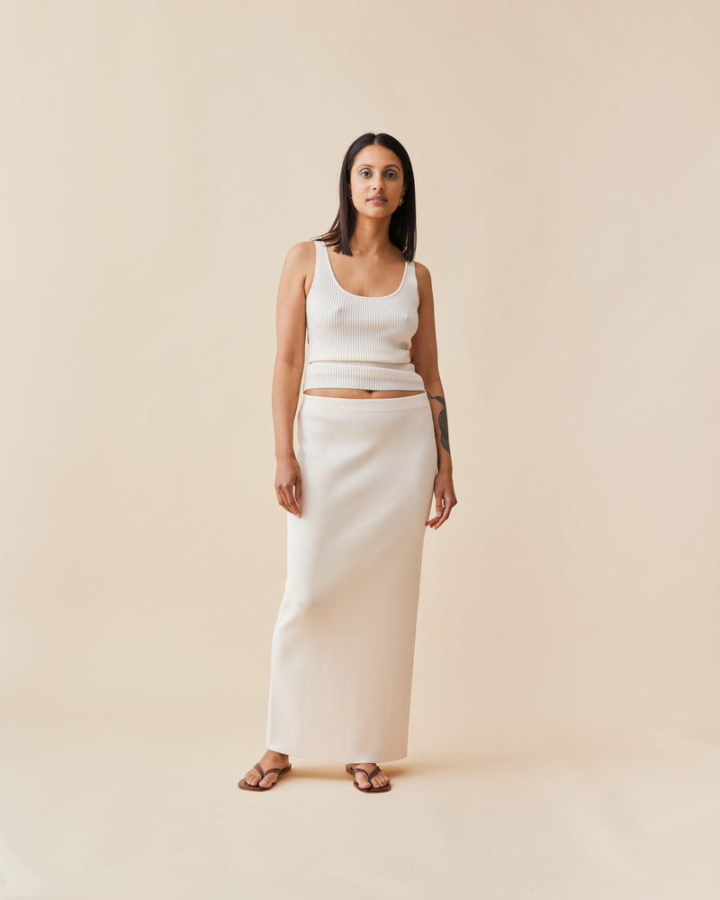 SIMPLE TANK CREAM | Simple scoop neck ribbed tank top, in a luxe cream shade. This tank is great for layering under your sheer tops or paired with your favourite denim.