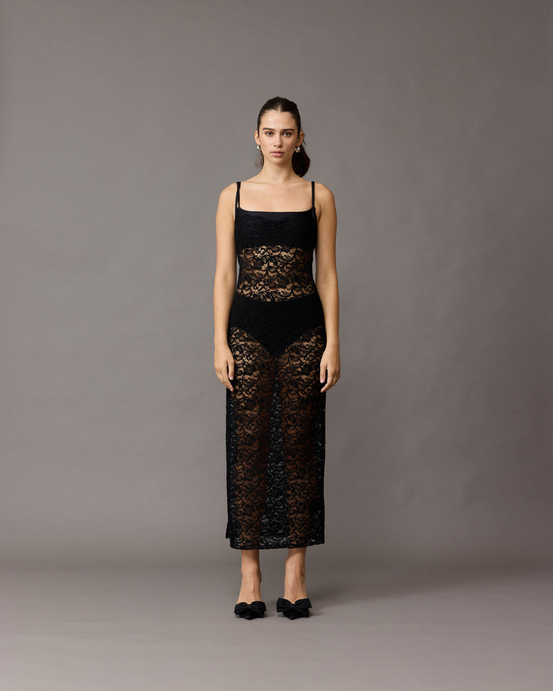 VITA LACE SLIP BLACK | Black slip dress crafted in a delicate lace with a sheer finish. Featuring a side split and delicate spaghetti straps, this dress is perfect for special occasions or worn as...