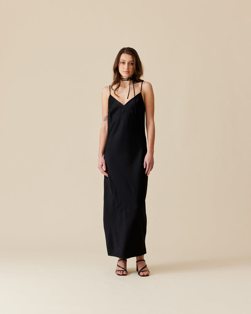 LOLA SLIP DRESS BLACK | V-neck slip dress designed in a soft satin fabric. This dress features a built in bust shelf for extra support, and comes with a detachable tie for you to style...