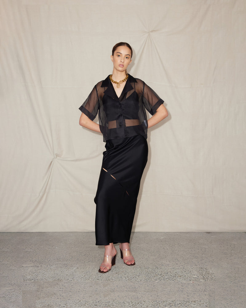 SESAME SILK SHIRT BLACK | Boxy fit sheer shirt crafted in a black organza silk. This shirt lets you play with sheerness to see the layers underneath.