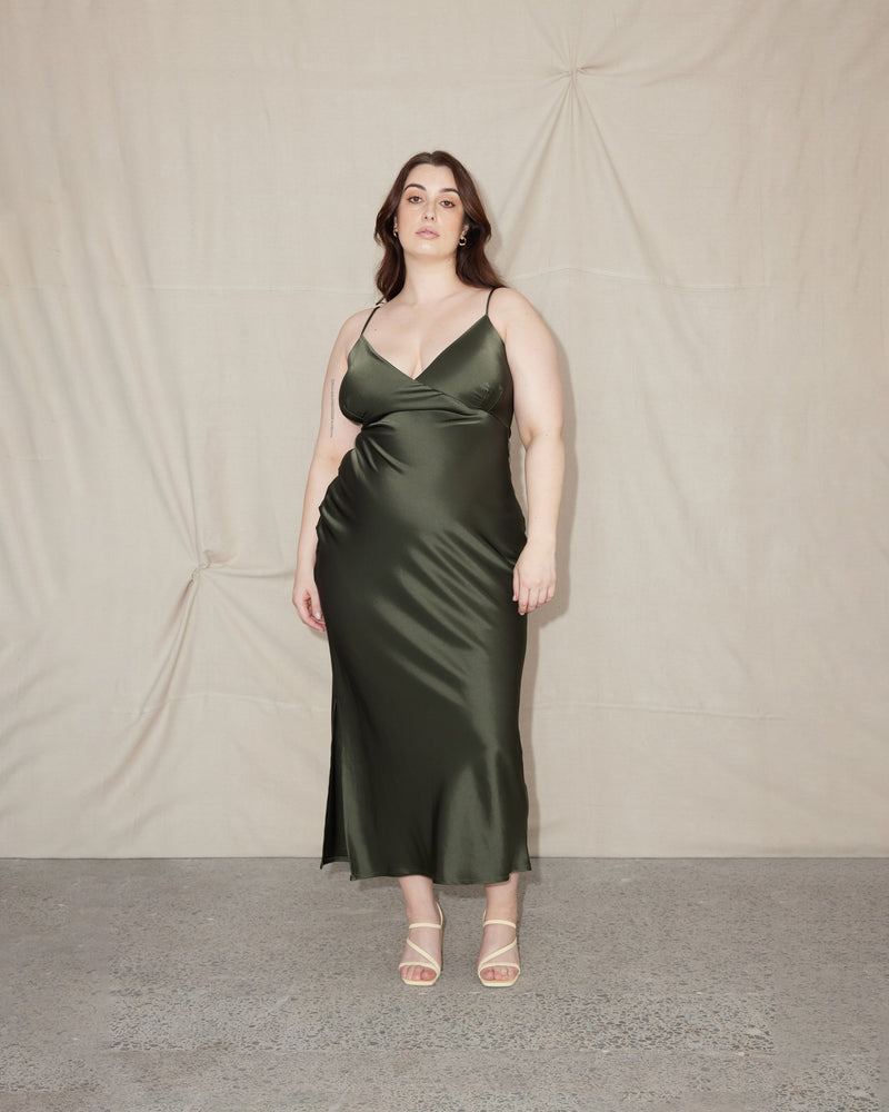 WEIRDLY SLIP JETTA GREEN | Iconic bias cut slip dress with plunging neckline in a new longer length. A wardrobe staple in heavy weight double satin that is lush to wear, in a rich jetta green colour.