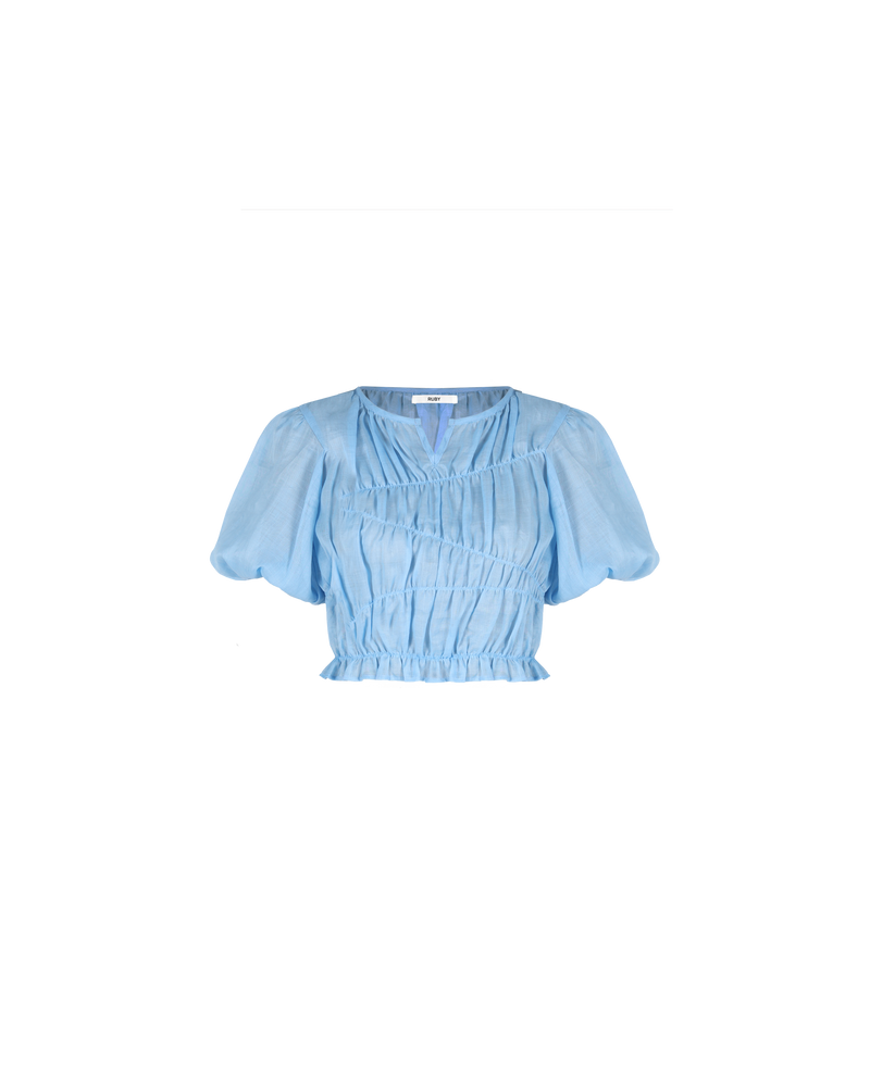 LILLIE TOP BLUE | Elasticated crop blouse with with puff sleeves and a frill hem, made from a delicate translucent ramie voile. The elastic detail creates texture in the piece, and contrasts with the...