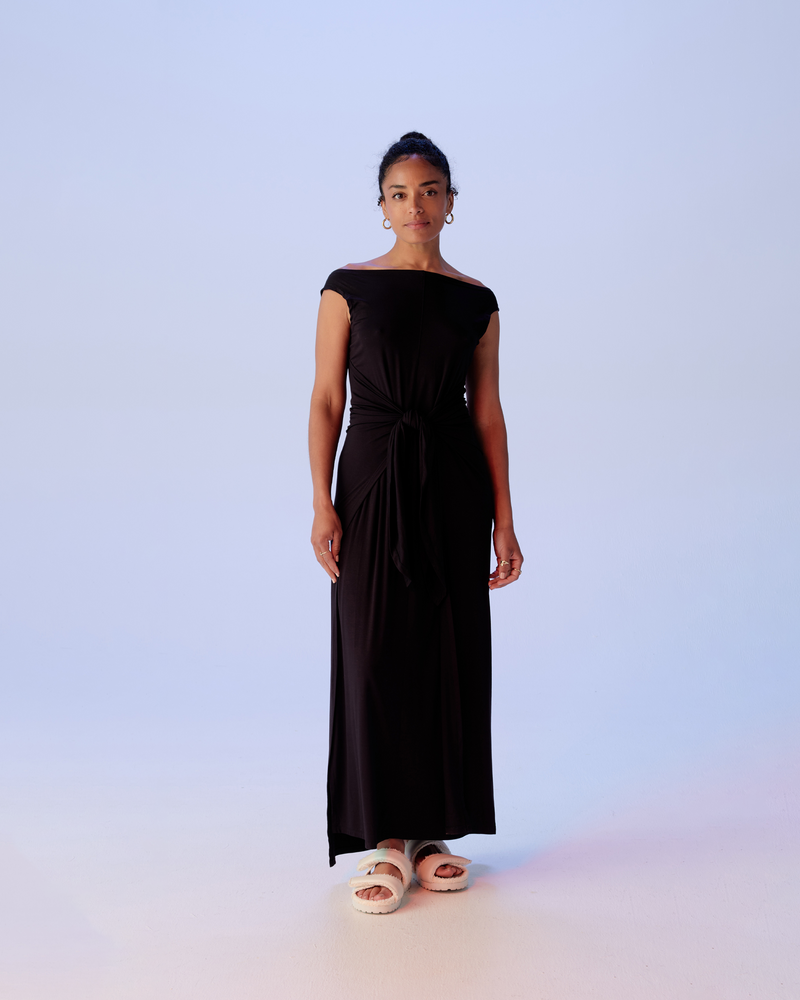 LENI WRAP DRESS BLACK | Boat neck knit maxi dress with wrap tie style front. This is a simple and versatile piece that is elevated by the tie detail, which can be wrapped many different...