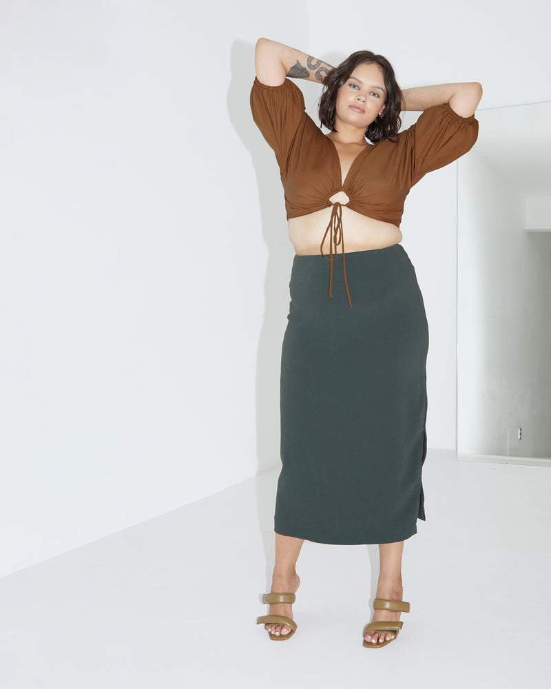 FIREBIRD SKIRT GREEN GABLE | The Firebird Skirt is a midi skirt with a zip opening in the side seam to create a side seam split. It features a panel seam line across the hipline...