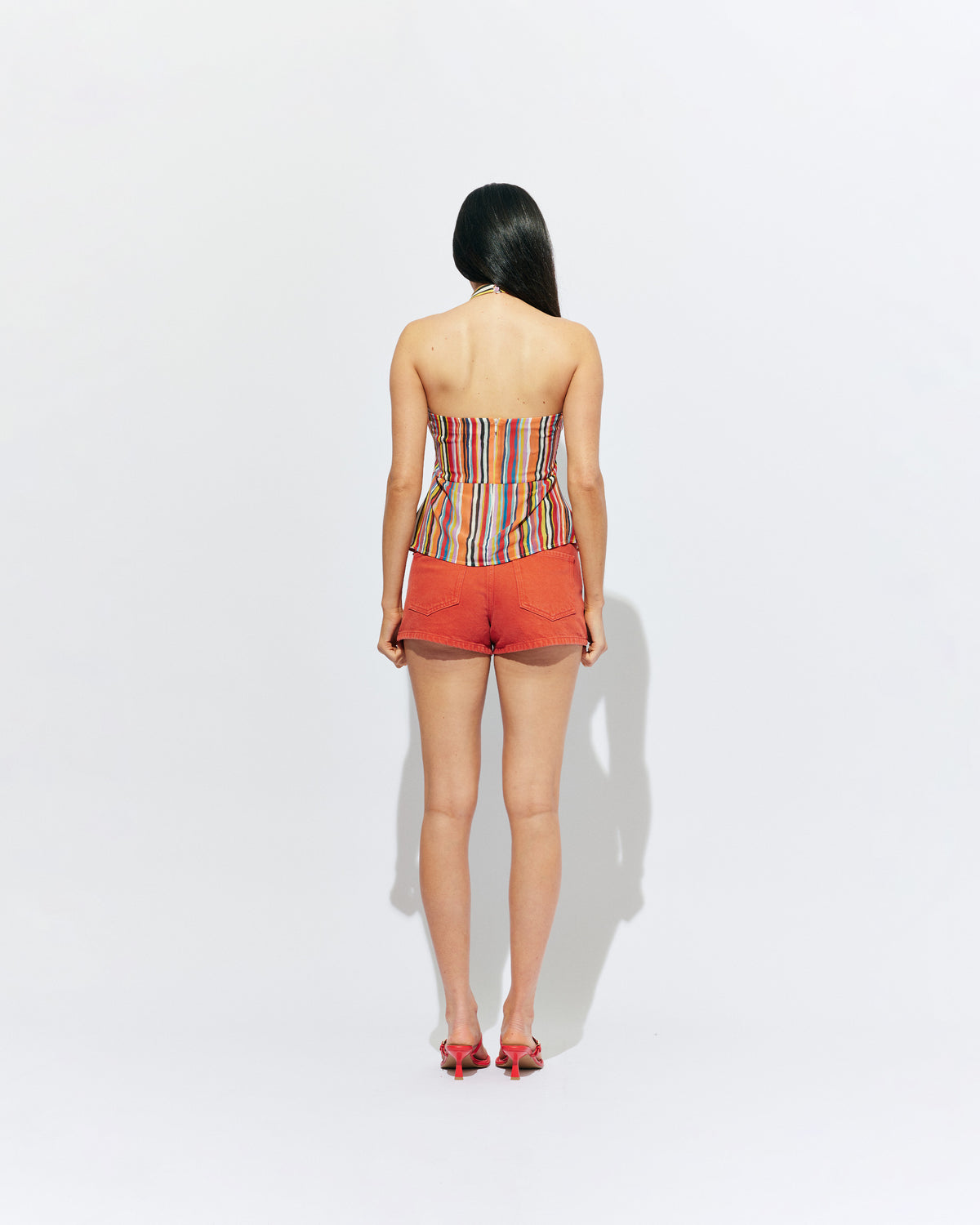 MADRID HALTER TOP LIQUORICE STRIPE | Backless halter top designed in our vibrant liquorice stripe. The ultimate statement piece to wear with your favourite summer shorts or denim. Pair it with the Lydia Head Scarf for the ultimate festival look.