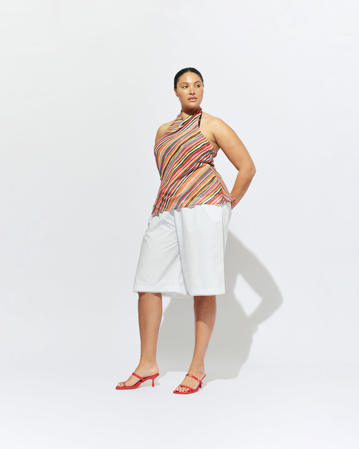 MADRID HALTER TOP LIQUORICE STRIPE | Backless halter top designed in our vibrant liquorice stripe. The ultimate statement piece to wear with your favourite summer shorts or denim. Pair it with the Lydia Head Scarf for the perfect festival look.