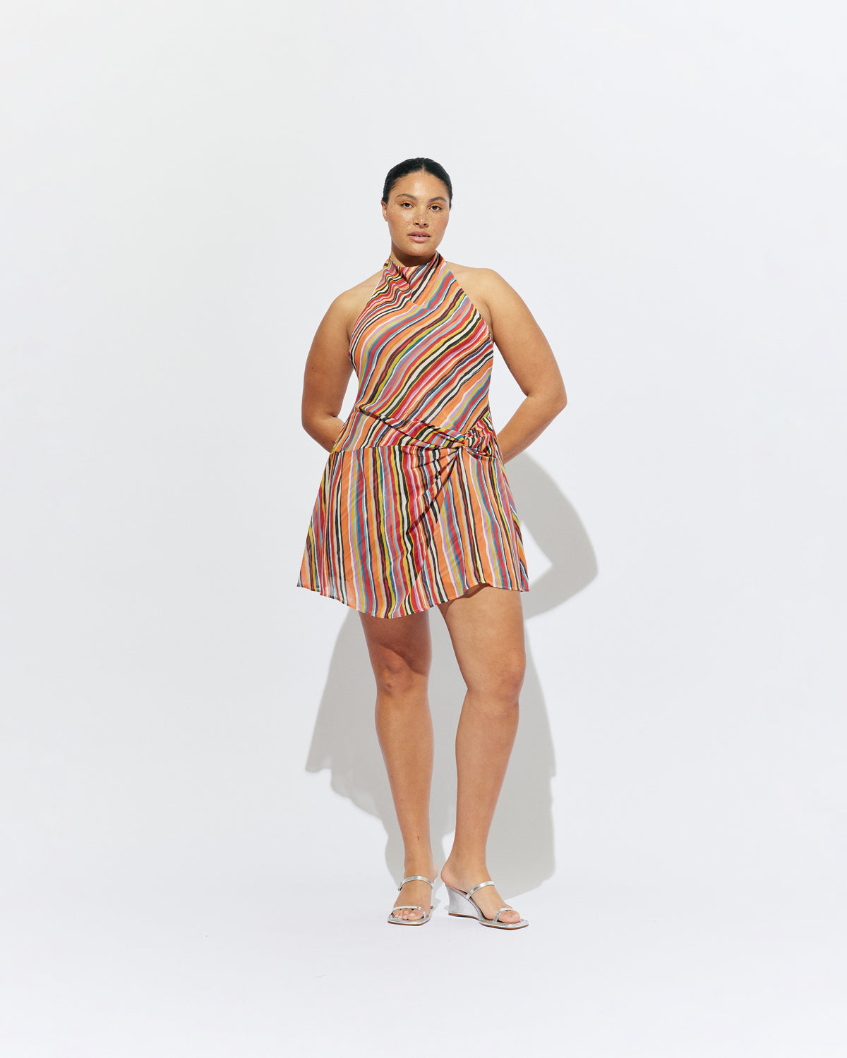 MADRID MINI DRESS LIQUORICE STRIPE | The newest addition to our Madrid story, this mini halter dress is designed in a vibrant liquorice stripe. Featuring a waist tie gather and open back, this dress is perfect over pants or as a statement on it's own.