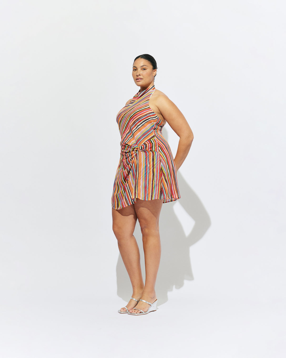 MADRID MINI DRESS LIQUORICE STRIPE | The newest addition to our Madrid story, this mini halter dress is designed in a vibrant liquorice stripe. Featuring a waist tie gather and open back, this dress is perfect over pants or as a statement on it's own.