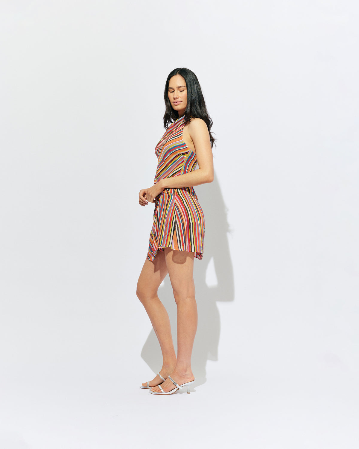 MADRID MINI DRESS LIQUORICE STRIPE | The newest addition to our Madrid story, this mini halter dress is designed in a vibrant liquorice stripe. Featuring a waist tie gather and open back, this dress is perfect over pants or as a statement on it's own.