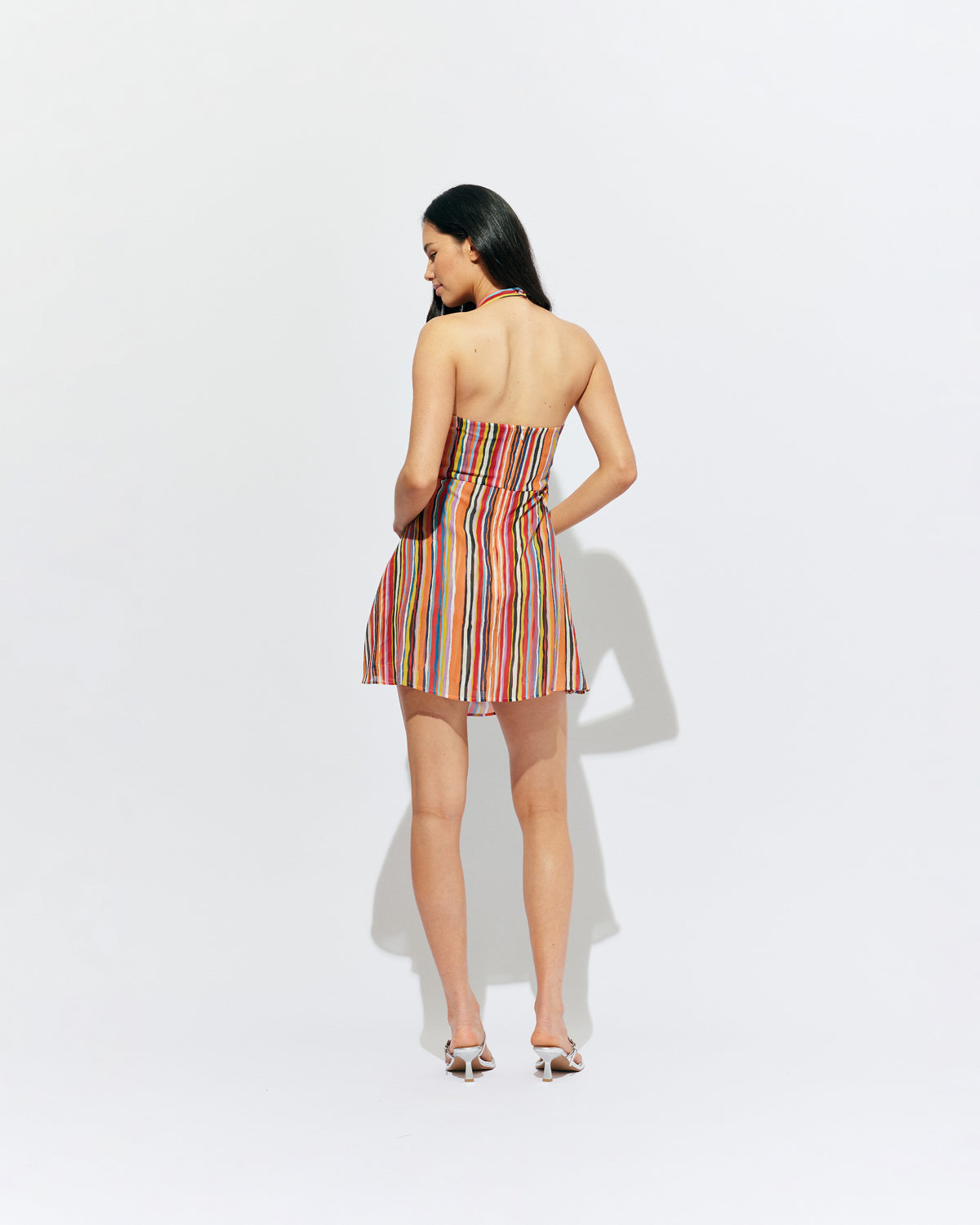 MADRID MINI DRESS LIQUORICE STRIPE | The newest addition to our Madrid story, this mini halter dress is designed in a vibrant liquorice stripe. Featuring a waist tie gather and open back, this dress is perfect over pants or as a statement on it's own.