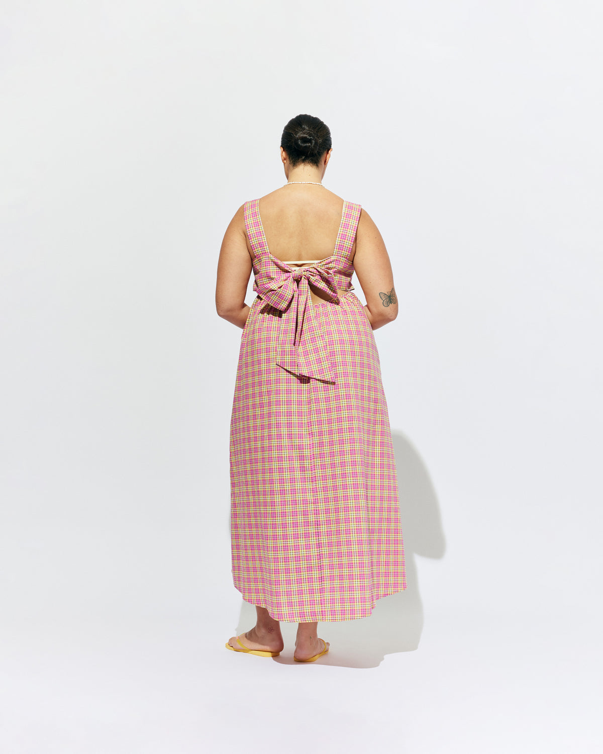 MARGIE TIE-BACK MAXI DRESS PINK YELLOW TARTAN | Cotton maxi dress with a square band bust and back tie, designed in our organic cotton pink yellow tartan. With a flowy silhouette through the body, this dress will keep you cute and cool in the warmer months.