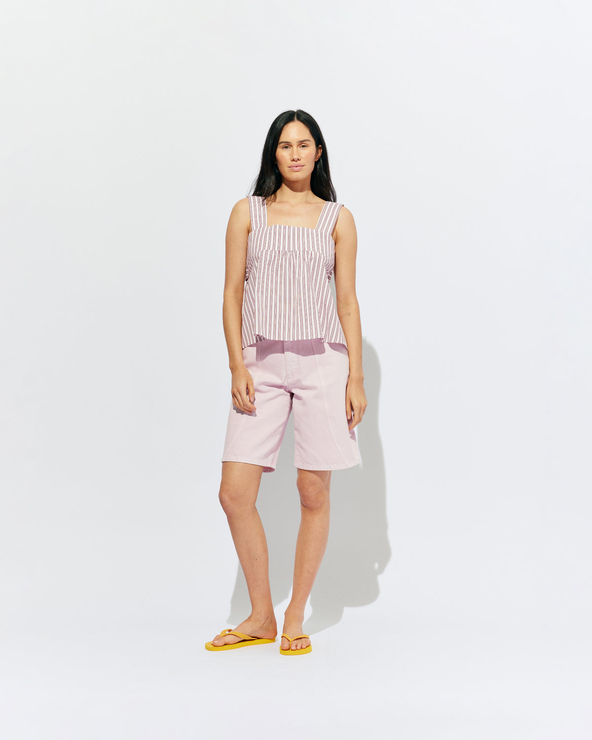 BUZZ SHORT PINK | Our RUBY favourite Buzz Jeans, now available in shorts. Designed in a soft pink denim, these mid-rise shorts have a longer length fit and a wide leg shape, making them perfect for any summer occasion. 