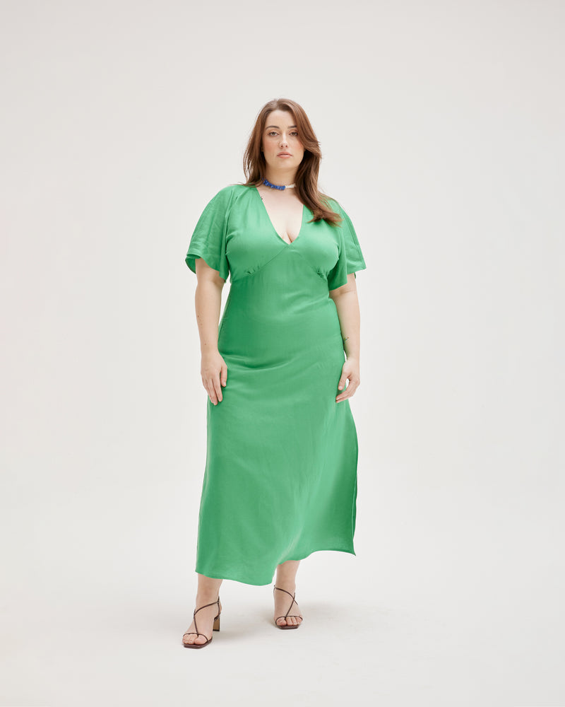 MATEA LINEN DRESS PARAKEET | Bias cut linen midi dress with a V-neckline and short floaty sleeves. Designed in a parakeet green, this is the perfect summer dress.