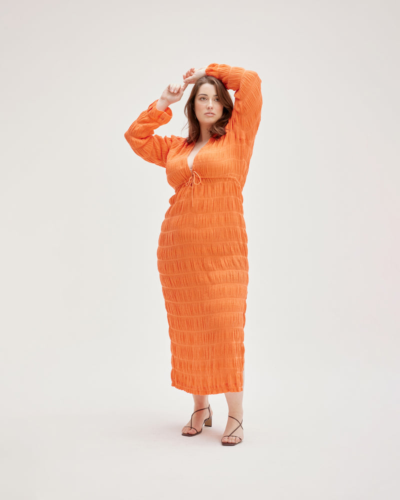 MIRELLA KAFTAN DRESS APEROL | Kaftan style maxi dress featuring a V-neck line, fluted long sleeves and an adjustable drawstring under the bust to create shape. Crafted in our signature Mirella fabric in a new...