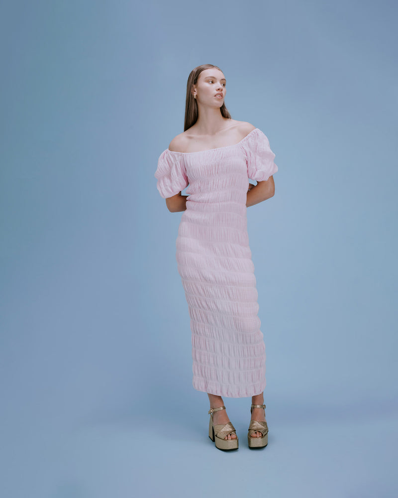 MIRELLA PUFF SLEEVE DRESS PINK | Fitted maxi dress with a square neckline, short elasticated puff sleeves and a slit at the centre back. The voluminous sleeves make this silhouette a stand out, crafted in signature...