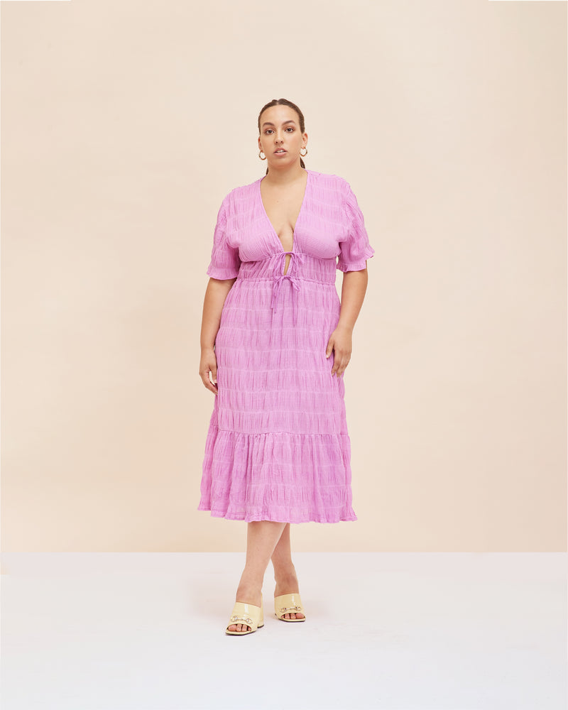 MIRELLA V-NECK DRESS ORCHID | Short sleeve midi dress with a deep V-neckline and a double drawstring waist in the signature Mirella fabric, a delicate embroidered cotton. A timeless silhouette appropriate for every occasion.