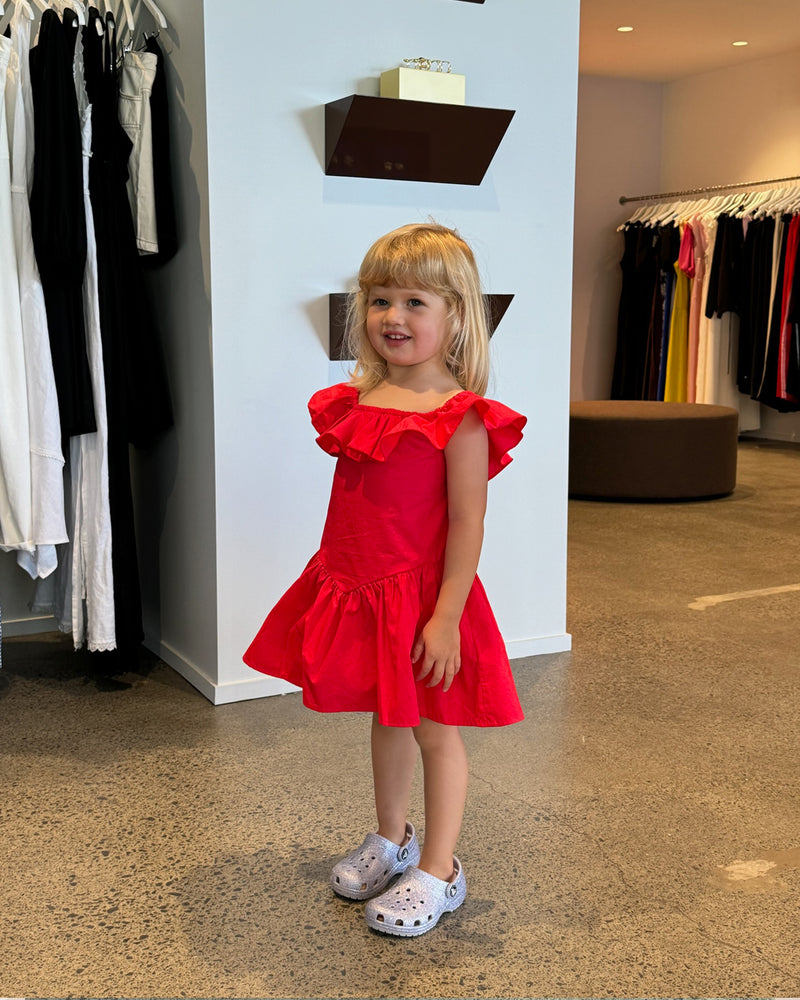 RUBÉBÉ MONACO SUNDRESS CHERRY | One for our Rubébé's! Cap sleeve mini dress with a feature ruffle across the neckline and sleeve. This dress has a fitted bodice with a dropped waist and falls to...