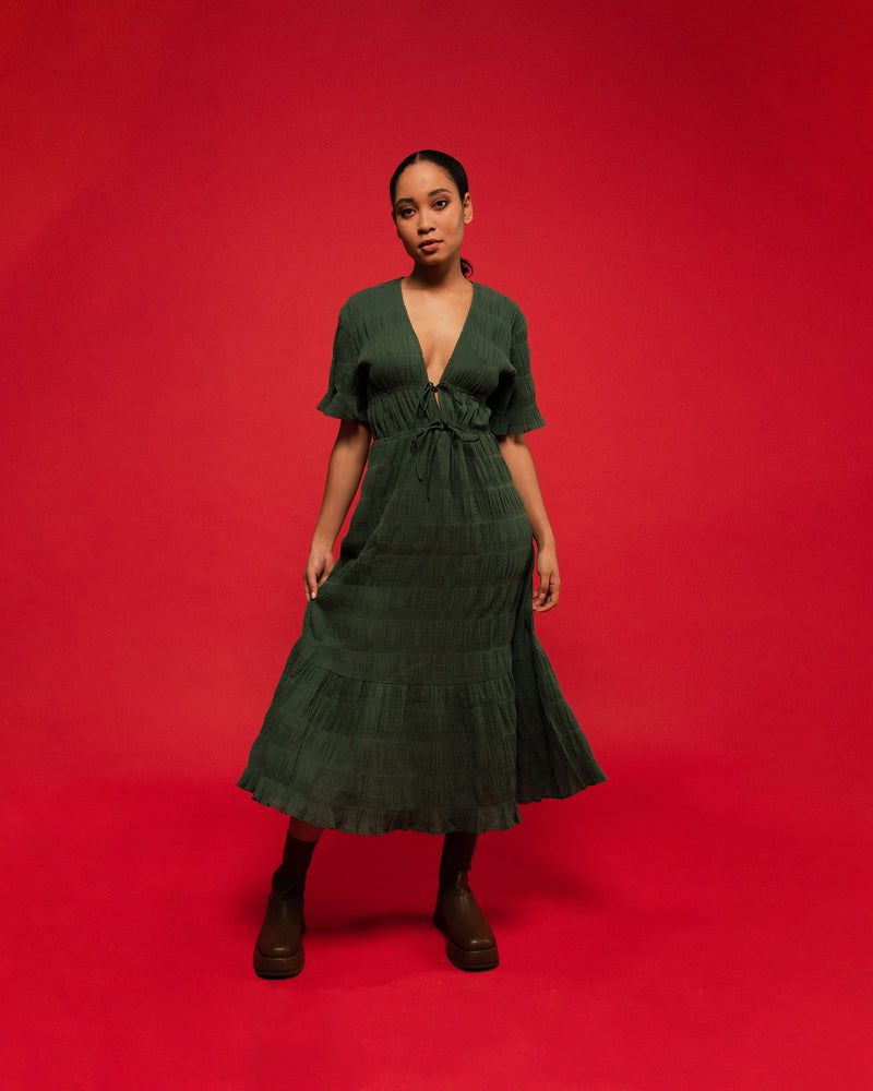 MIRELLA V-NECK DRESS GREEN | Short sleeve midi dress with a deep V-neckline and a double drawstring waist in the signature Mirella fabric, a delicate embroidered cotton. A timeless silhouette appropriate for every occasion.