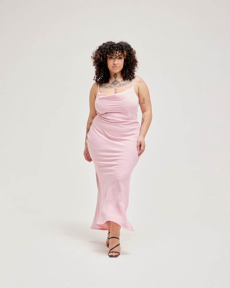 POPPY COWL DRESS BUBBLEGUM | Statuesque maxi dress with a cowl neckline and adjustable spaghetti straps, imagined in a luxurious bubblegum cupro. This piece is cut on the bias to accentuate the figure-skimming fit.