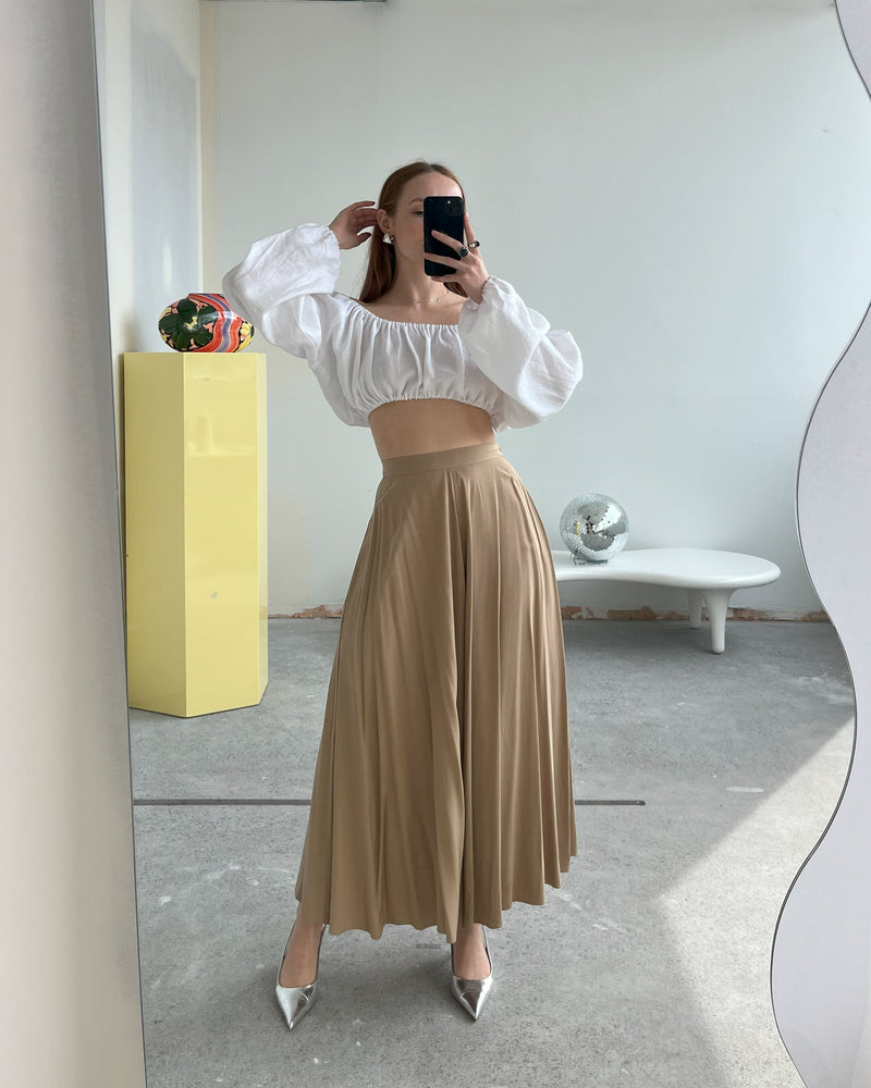 RSR SAMPLE 3442 PLEATED MIDI SKIRT | RUBY Sample Pleated Midi Skirt in Camel. Size 8. One available. Danni is 163cm tall and usually wears a size 6-8. She measures: BUST: 81cm, WAIST: 67cm, HIP: 93cm. PLEASE NOTE: SMALL...