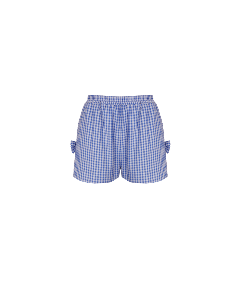 RAQUEL BOW SHORT BLUE GINGHAM | Mid-waist cotton shorts designed in a blue gingham. These shorts feature a bow detail at each side seam. Make it a set by pairing these shorts with the Raquel Top. 