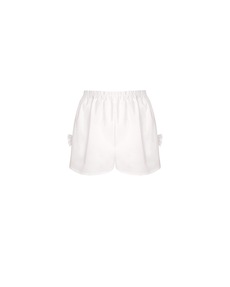 RAQUEL BOW SHORT WHITE | Mid-waist cotton shorts designed in a crisp white organic cotton. These shorts feature a bow detail at each side seam. Make it a set by pairing these shorts with the...