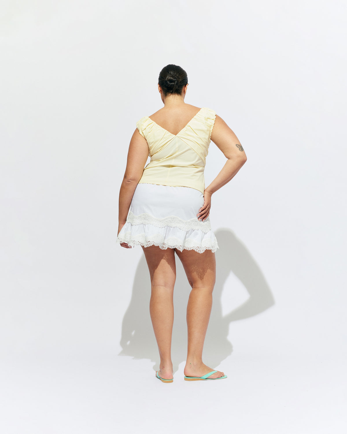 TIDE MINI SKIRT WHITE | A-line mini skirt with broderie trim details, designed in our white organic cotton. With tiered skirt and elastic waistband, this is the perfect everyday skirt to keep you cool in the warmer months. 