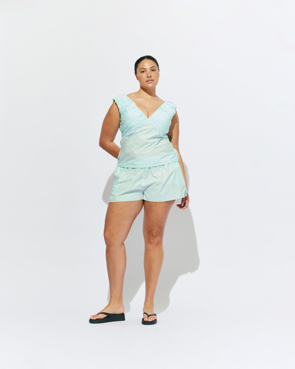 RAQUEL TOP MINT JULEP | Crafted in a mint julep organic cotton fabric with ruched detailing at the bust, this top can be worn on or off the shoulder. The tailored fit is designed to sit close to your body without feeling too tight. Make...