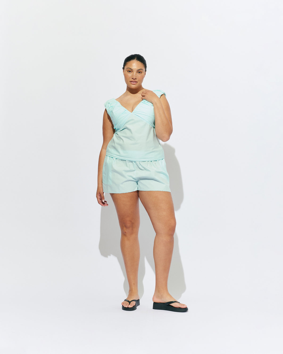 CRUSH SHORT MINT JULEP | Low-waisted organic cotton shorts, designed in our mint julep organic cotton. Featuring a scalloped hem and broderie detailing on the sides, pair with your favourite tank for an everyday summer look.