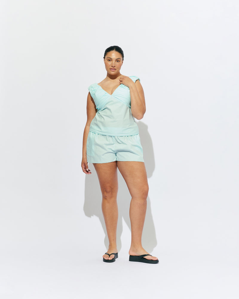 CRUSH COTTON SHORT MINT JULEP | Low-waisted organic cotton shorts, designed in our mint julep organic cotton. Featuring a scalloped hem and broderie detailing on the sides, pair with your favourite tank for an everyday summer look or with our Raquel Top for a matching moment.