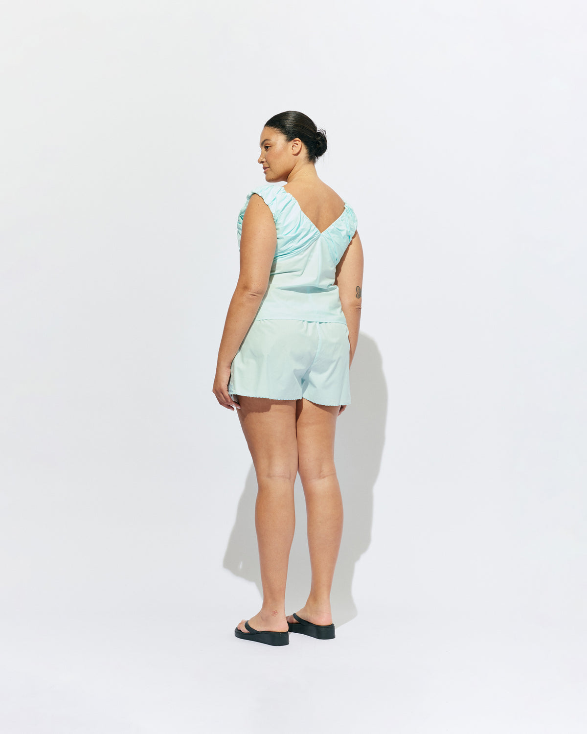 CRUSH SHORT MINT JULEP | Low-waisted organic cotton shorts, designed in our mint julep organic cotton. Featuring a scalloped hem and broderie detailing on the sides, pair with your favourite tank for an everyday summer look.