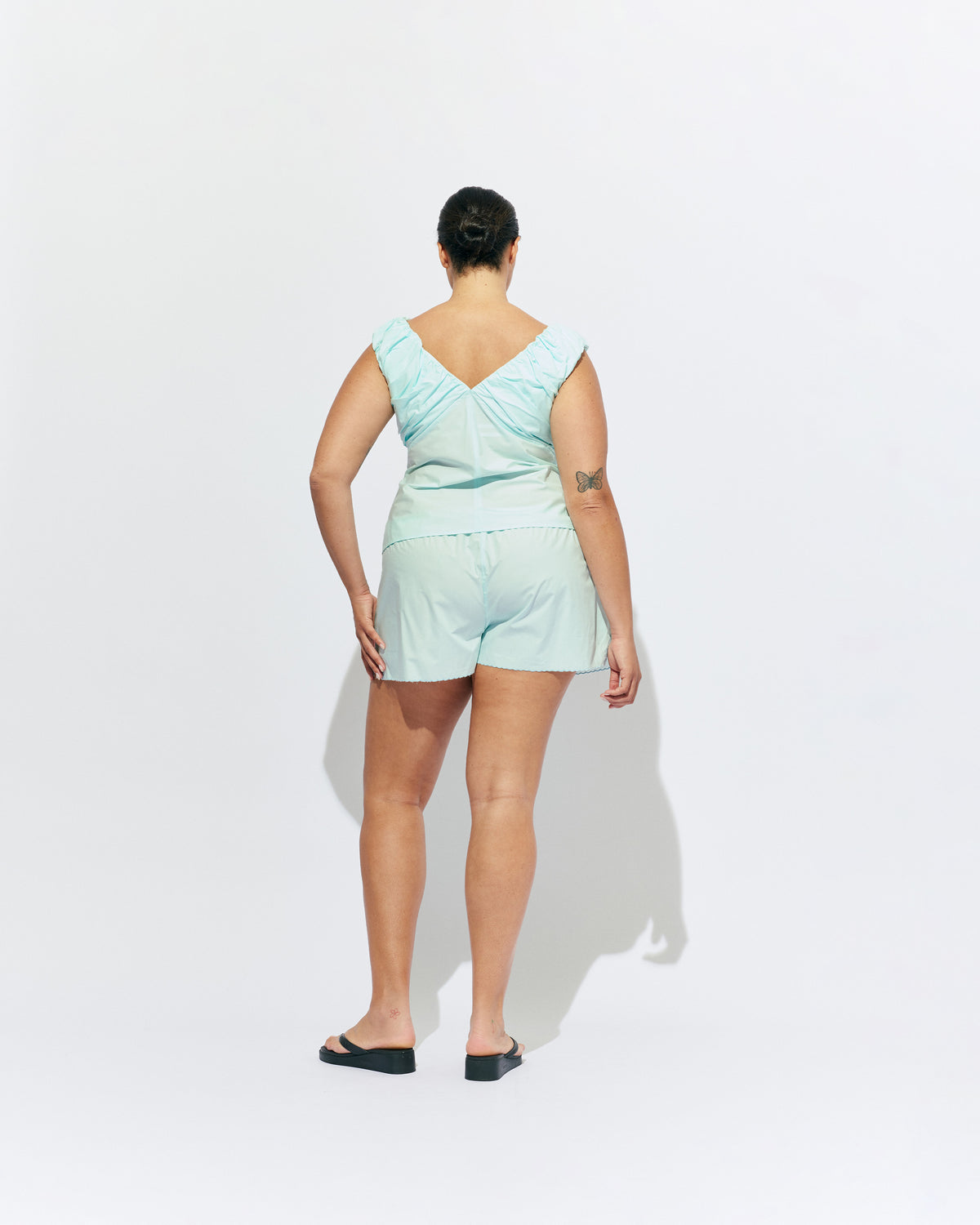 CRUSH SHORT MINT JULEP | Low-waisted organic cotton shorts, designed in our mint julep organic cotton. Featuring a scalloped hem and broderie detailing on the sides, pair with your favourite tank for an everyday summer look.