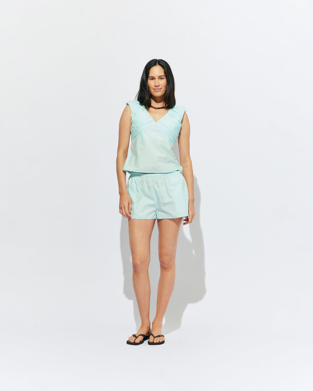 CRUSH SHORT MINT JULEP | Low-waisted organic cotton shorts, designed in our mint julep organic cotton. Featuring a scalloped hem and broderie detailing on the sides, pair with your favourite tank for an everyday summer look.