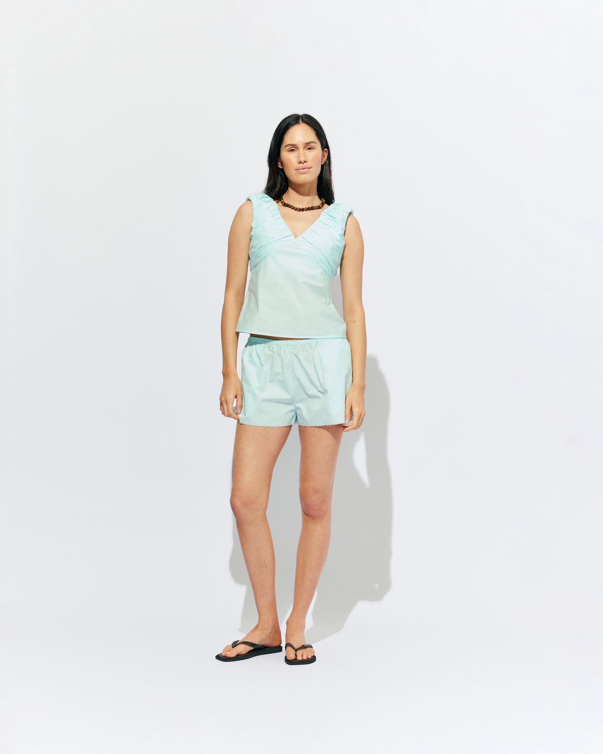 RAQUEL TOP MINT JULEP | Crafted in a mint julep organic cotton fabric with ruched detailing at the bust, this top can be worn on or off the shoulder. The tailored fit is designed to sit close to your body without feeling too tight. Make...