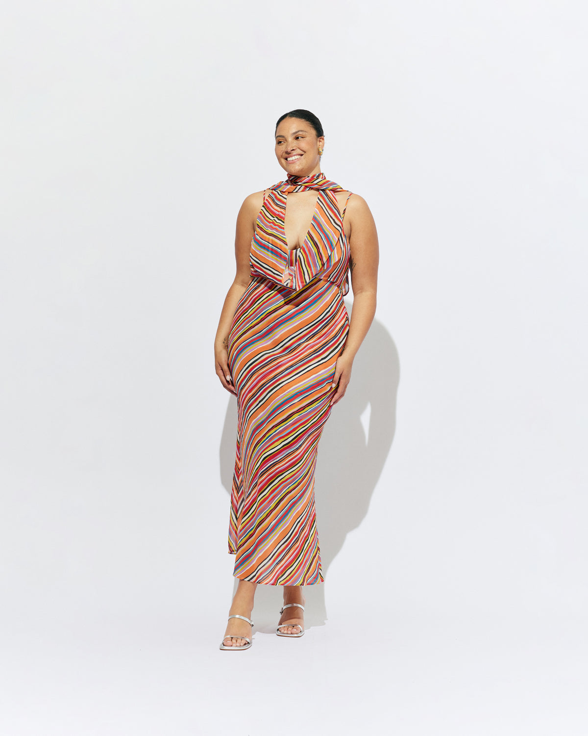 RILEY SASH DRESS LIQUORICE STRIPE | Bias cut maxi dress designed in a liquorice stripe chiffon. This dress features a built in bust panel that you can wear around the neck as a scarf, tied at the back, or over the shoulders for a cowl neck...