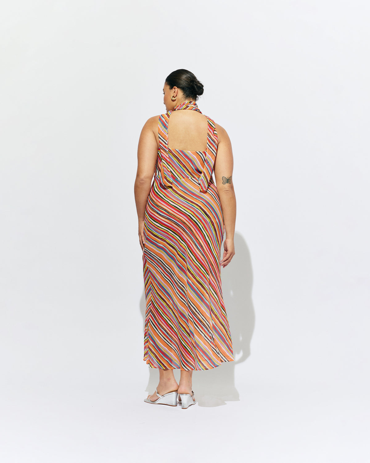 RILEY SASH DRESS LIQUORICE STRIPE | Bias cut maxi dress designed in a liquorice stripe chiffon. This dress features a built in bust panel that you can wear around the neck as a scarf, tied at the back, or over the shoulders for a cowl neck...