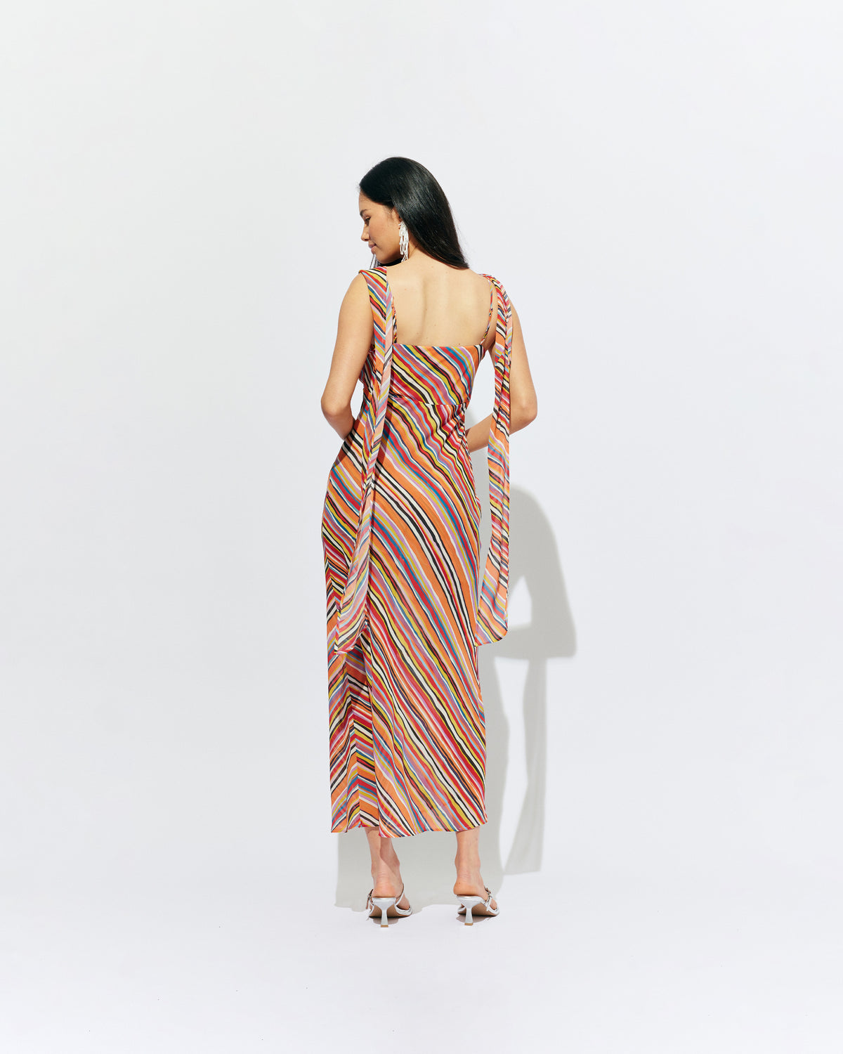RILEY SASH DRESS LIQUORICE STRIPE | Bias cut maxi dress designed in a liquorice stripe chiffon. This dress features a built in bust panel that you can wear around the neck as a scarf, tied at the back, or over the shoulders for a cowl neck...