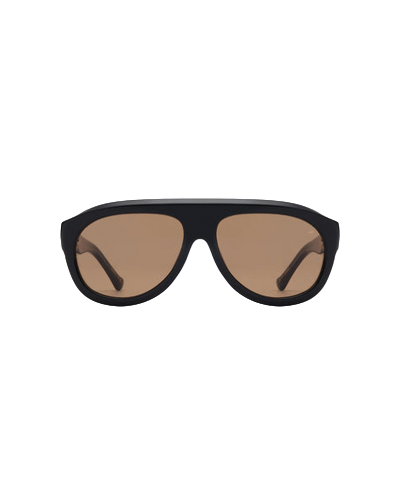 RIO SUNGLASS BLACK | A reinterpretation of the aviator style with a distinctive and sculptural frame. Featuring a large silhouette and deep acetate frame, designed in a black colourway with brown tinted lenses.