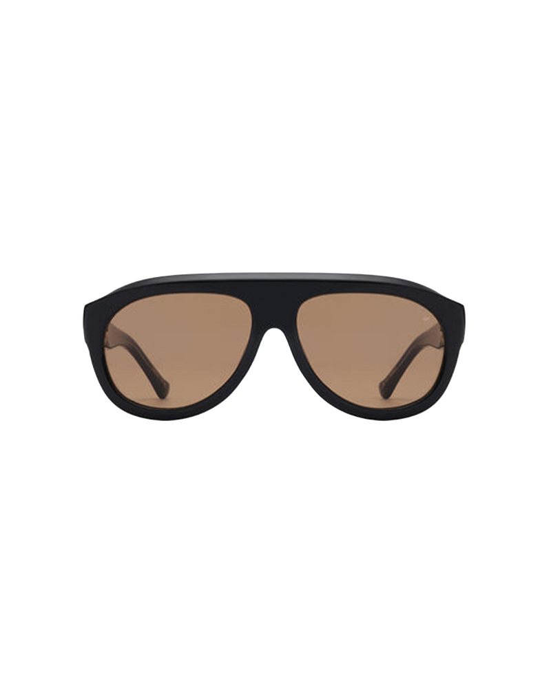 RIO SUNGLASS BLACK | A reinterpretation of the aviator style with a distinctive and sculptural frame. Featuring a large silhouette and deep acetate frame, designed in a black colourway with brown tinted lenses.