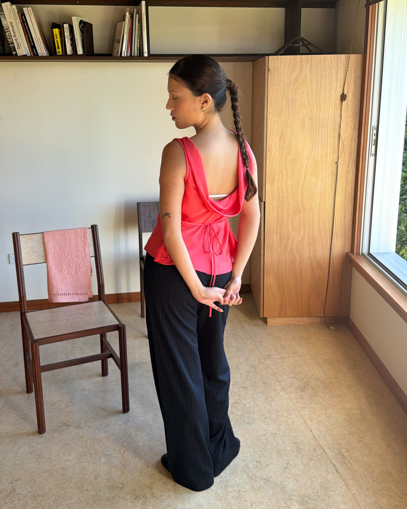 FIREBIRD COWL SLEEVELESS TOP ROSIE | A Rubette favourite, the Firebird Cowl Sleeveless Top crafted in a luxe rosie pink. Featuring a minimal silhouette with a cowl back detail and a tie to cinch in the waist, this top is the perfect statement piece for any...