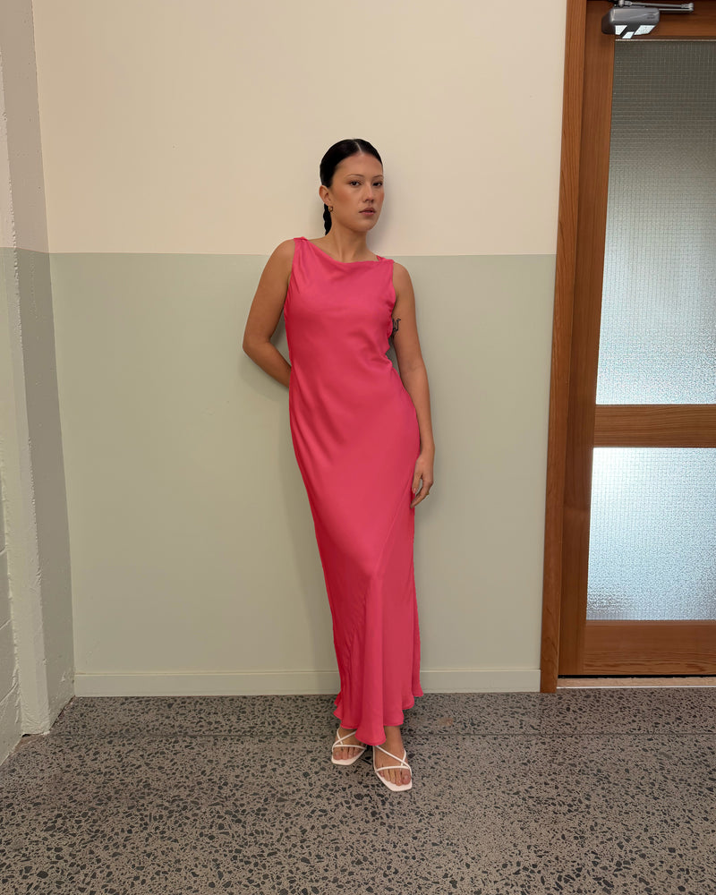 FIREBIRD COWL GOWN ROSIE | A Rubette favourite, the Firebird Cowl Gown crafted in a luxe rosie pink. Featuring a minimal silhouette with a cowl back detail and a tie to cinch in the waist, this is the perfect dress for any wedding or special...
