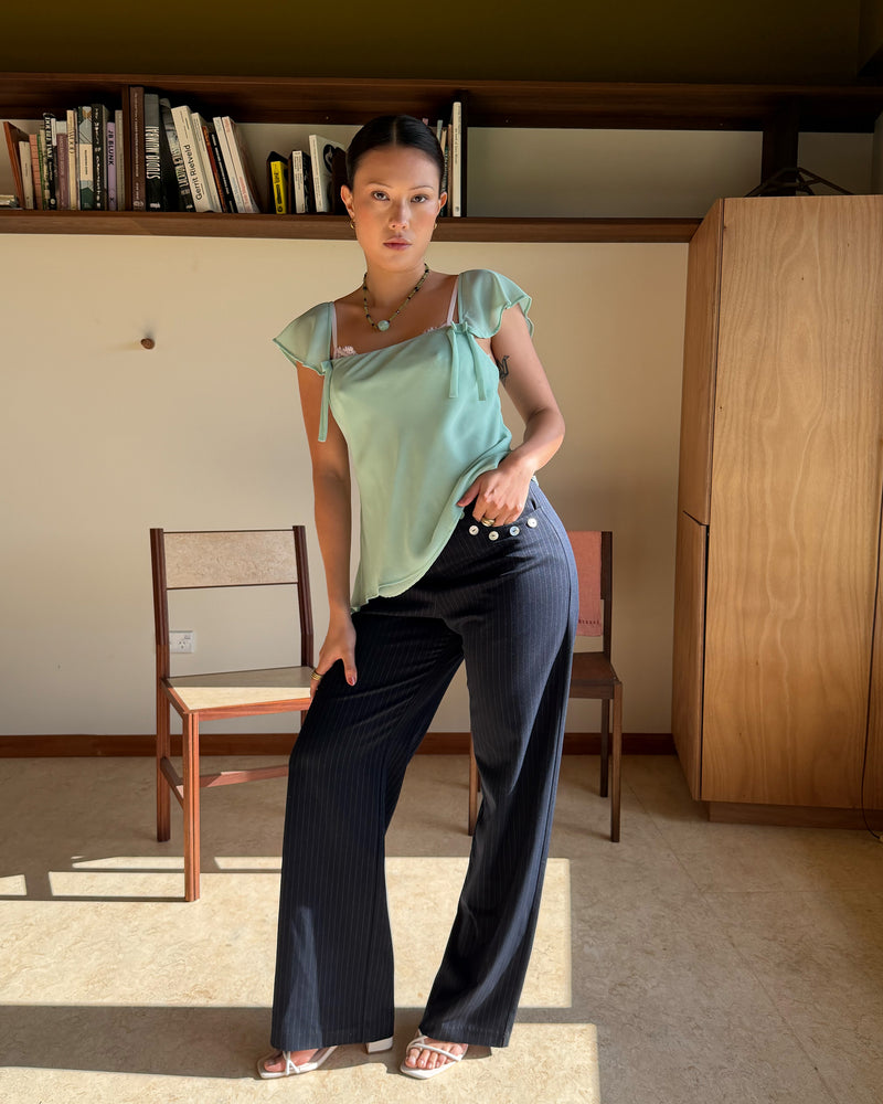 SABRINA CAMISOLE AQUAMARINE | Your new favourite top ~ the Sabrina Cami is designed in an aquamarine lightweight chiffon, with delicate cap sleeves, an asymmetrical hemline and bow detailing. Pair it with denim for the perfect evening plans outfit, or your favourite skirt for...