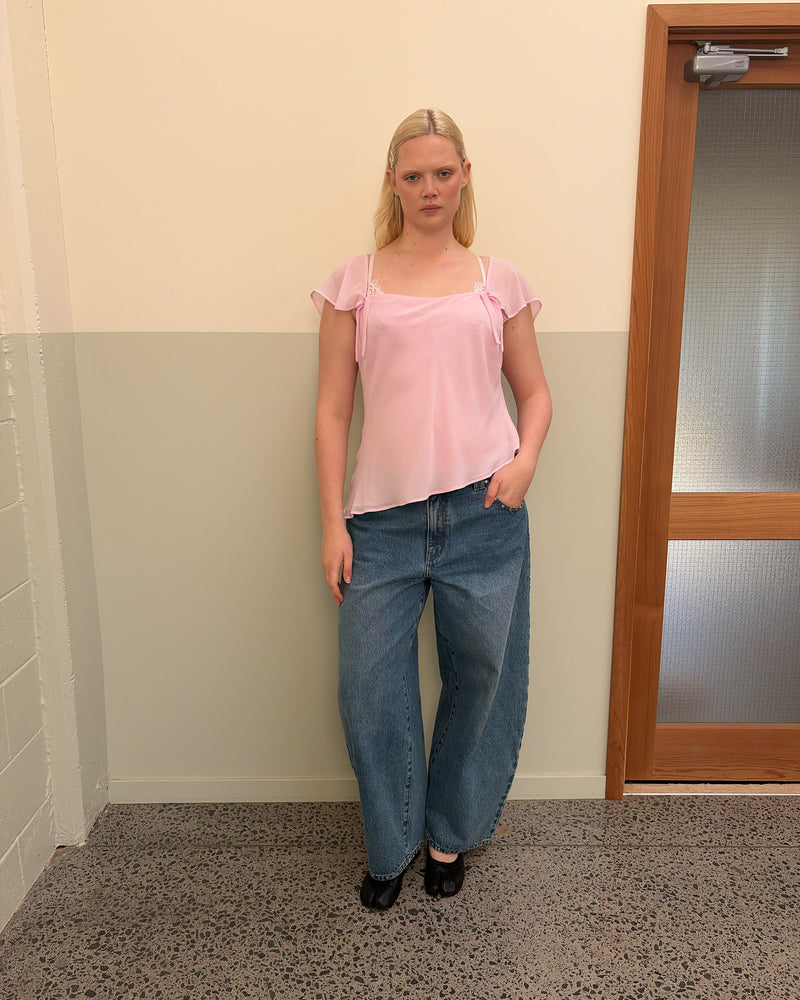 SABRINA CAMISOLE PINK | Your new favourite top ~ the Sabrina Cami is designed in a baby pink light-weight chiffon, with delicate cap sleeves, an asymmetrical hemline and bow detailing. Pair it with denim for the perfect evening plans outfit, or your favourite skirt...