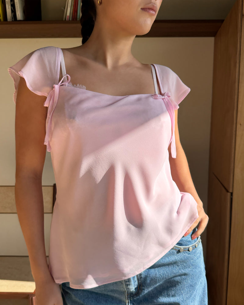 SABRINA CAMISOLE PINK | Your new favourite top ~ the Sabrina Cami is designed in a baby pink light-weight chiffon, with delicate cap sleeves, an asymmetrical hemline and bow detailing. Pair it with denim for the perfect evening plans outfit, or your favourite skirt...
